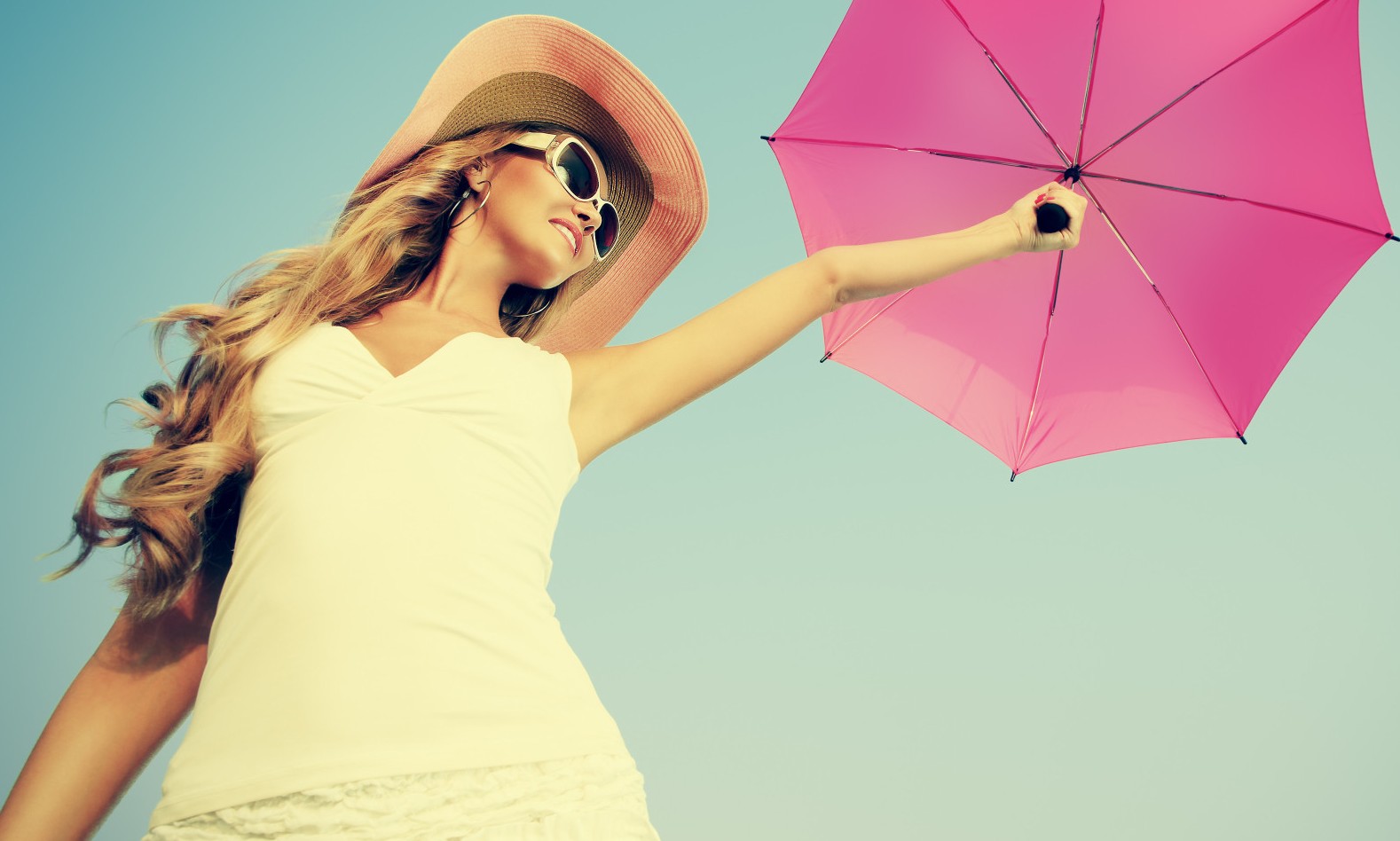 woman in sunglasses with umbrella
